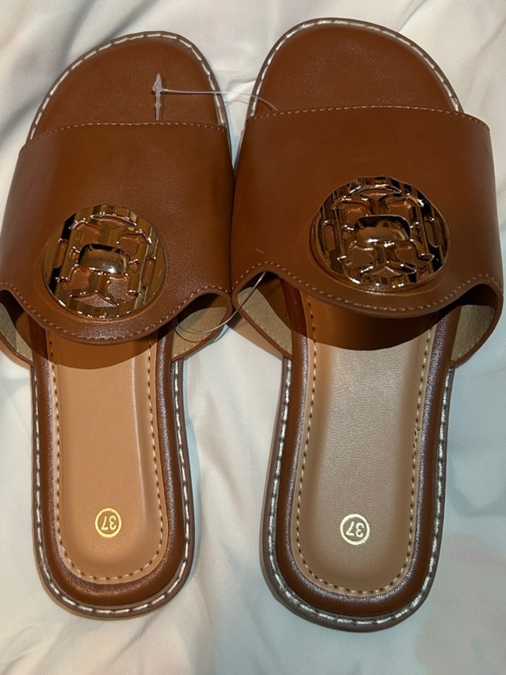 Women’s Tan Slide Mules with Decorative Medallion